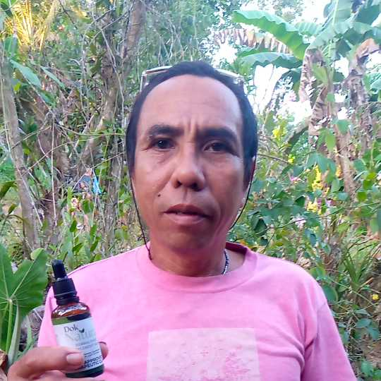 Alex Quisumbing holding Dok Natural Herbal Food Supplement Drops bottle, customer testimonial photo