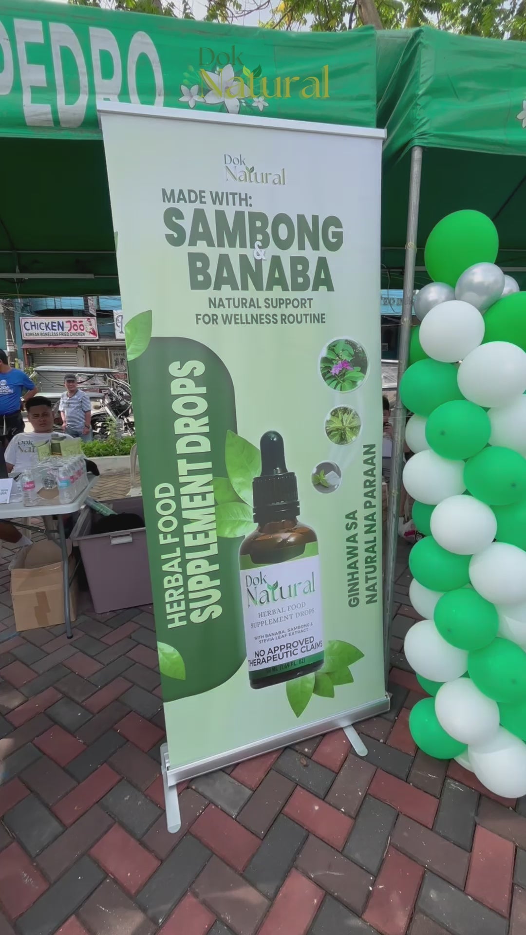 DOK NATURAL Herbal Food Supplement Drops booth display — Ginhawa Day event with Sambong and Banaba banner, FDA Registered, No Approved Therapeutic Claims